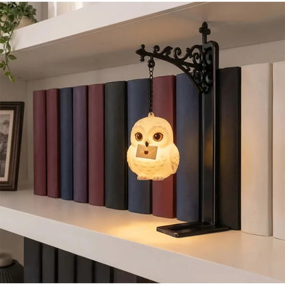 Hollow Light magical bookend lantern glowing on a bookshelf